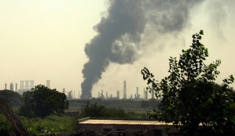 Smoke billows from a refinery operated by India's Reliance Industries at Jamnagar in western India.