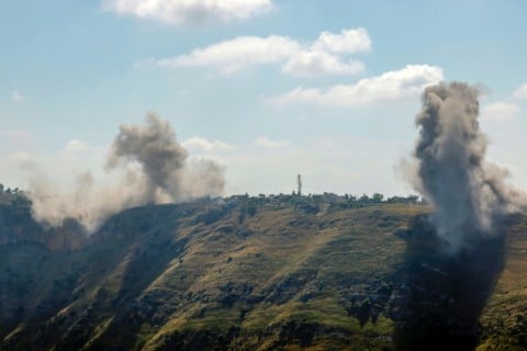 A photograph taken from the Marjayoun area in southern Lebanon shows smoke rising after an Israeli air strike on the village of Arnoun on May 30