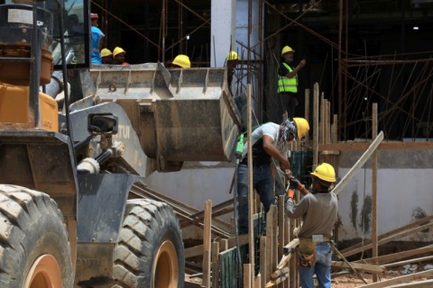 Labourers work at Al-Wahda Central Hospital, being built as part of Derna's reconstruction