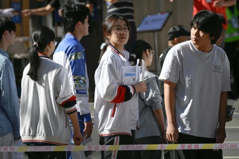 Some students were still cramming as they waited in line to sit the exam