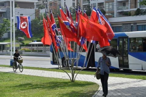 Pyongyang's streets were lined with flags of North Korea and China for Xi's visit