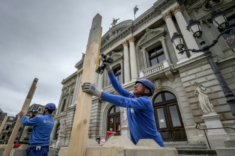 Workers installing a wooden barricade around the Grand Theatre in Geneva ahead of expected anti-G7 demonstrations in the city