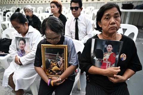 Mourners hold photos of Thai princess Bajrakitiyabha Mahidol inside Chulalongkorn Hospital in Bangkok