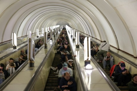 People shelter in a metro station during a Russian missile strike on the Ukrainian capital
