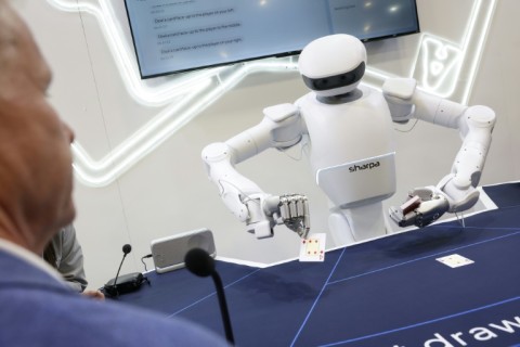 A Sharpa robot deals cards for a game of blackjack during the annual Consumer Electronics Show (CES) in Las Vegas