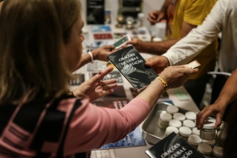 Books, anointing oils and exorcised salt are offered for sale at the monthly exorcism retreats