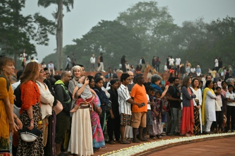 People gather at the amphitheatre in front of the Matrimandir 'Temple of the Mother' in Auroville