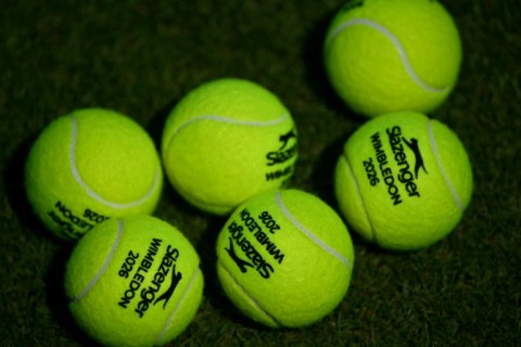Tennis balls are pictured on the practice courts
