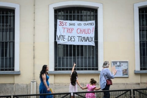 '35C in classrooms is too hot,' read a banner on a Paris school last week, urging renovations