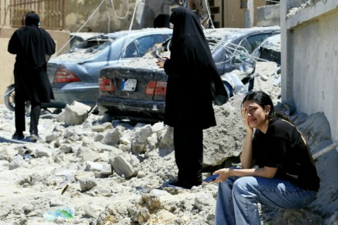 A woman weeps at the site of an Israeli airstrike that targeted the southern Lebanese village of Qennarit on June 20, 2026