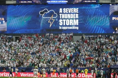 Fans are warned to leave their seats due to an incoming storm during France's World Cup game against Iraq