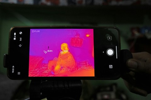 Durga Devi seen through a thermal imaging camera used to record temperature at her house in New Delhi