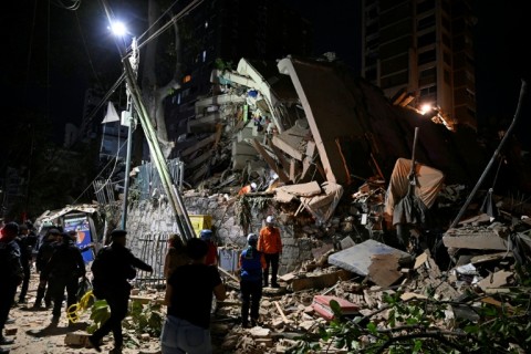 Rescuers work at the site of a collapsed building in Caracas on June 25, 2026