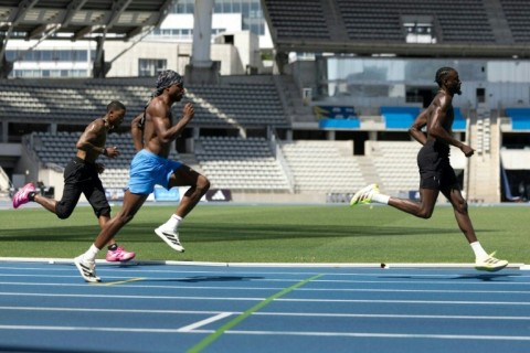Noah Lyles (C) training with Jordan Anthony (L) and Jereem Richards (R) at Charlety Stadium in Paris on June 25, 2026