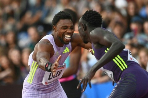 Noah Lyles (L) celebrates with Gout Gout after the American won the 150m at Ostrava on June 16, 2026