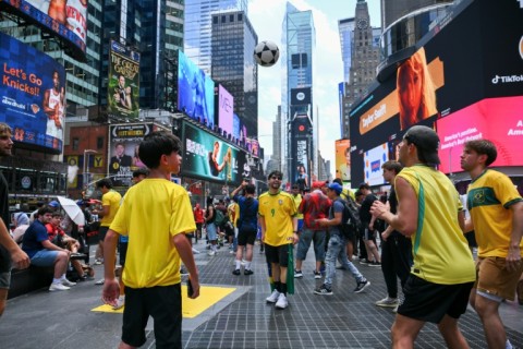 Some supporters have taken to playing soccer in Times Square