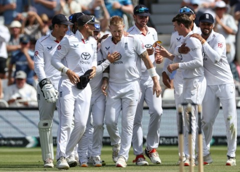 Teammates celebrate after England's Ben Stokes takes the wicket of New Zealand's Zak Foulkes on the fourth day of the third Test at Trent Bridge