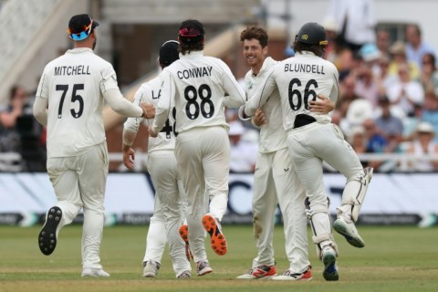 New Zealand's Mitchell Santner (2R) is congratulated after dismissing England's Jamie Smith to seal a 160-run win for the Black Caps in the third Test at Trent Bridge