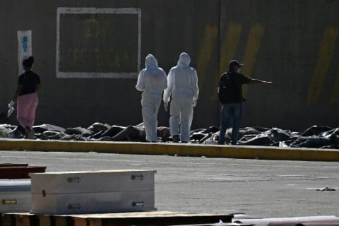 A temporary morgue has been set up at the port in La Guaira, north of Caracas
