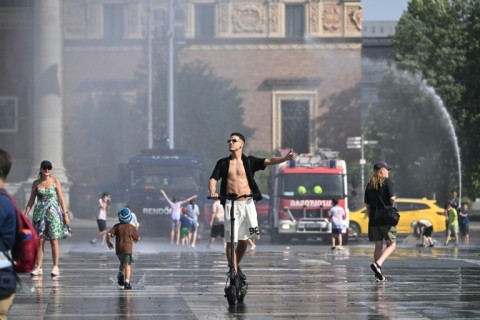 In the capital Budapest, police and fire service vehicles sprayed water around to cool people off in the scorching weather