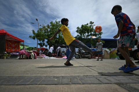 Children are finding joy in football even as they have been left homeless by the twin quakes