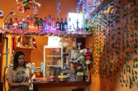 Budhathoki Samjhana, a restaurant owner and business manager visa holder at Chitwan Rhino Restaurant and Bar, inside her bar in the Okubo–Shin area