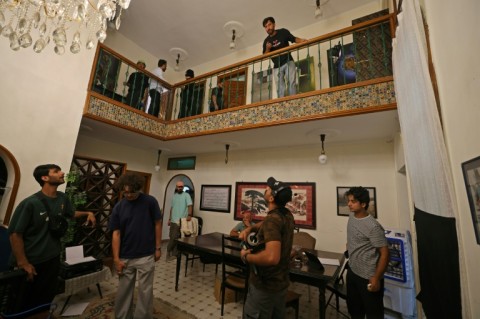 Crew members prepare a set for a scene during the filming of an Iraqi horror movie in the capital Baghdad