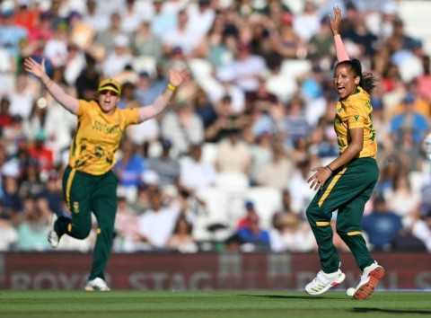 South Africa's Shabnim Ismail (R) celebrates her dismissal of England's Alice Capsey during the Women's T20 World Cup semi-final at the Oval