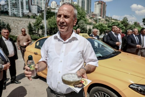Taxi drivers will wear grey trousers and white shirts and offer their clients water, cologne and Turkish Delight