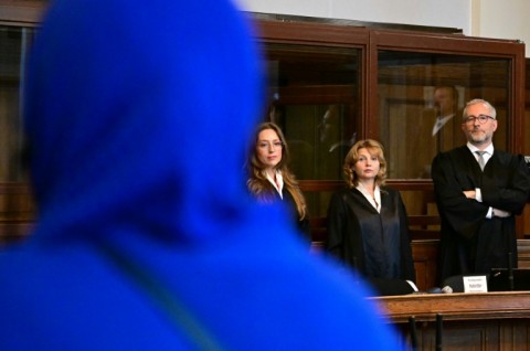 The defendant's lawyers, Klaudia Dawidowic, Ria Halbritter and Christoph Stoll, at the start of the trial in the Regional Courtroom in Berlin, on July 14, 2025