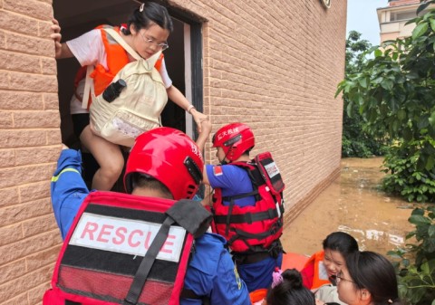 Rescue workers evacuate flood-affected students in Guigang, in China's southern Guangxi region