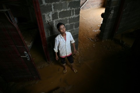 Streets and houses in China's Liulan village are swamped with thick mud