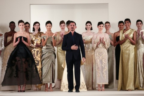 Syrian fashion designer Rami Al Ali with models at the end of his show