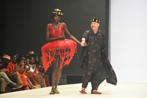 Kuame (R) with a model in one of his creations at Lagos Fashion Week, 2022