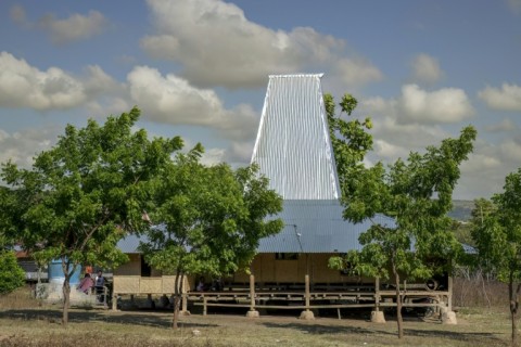 A Sumba house with its towering hat-shaped roof in Tanggedu village. More traditional ones are thatched