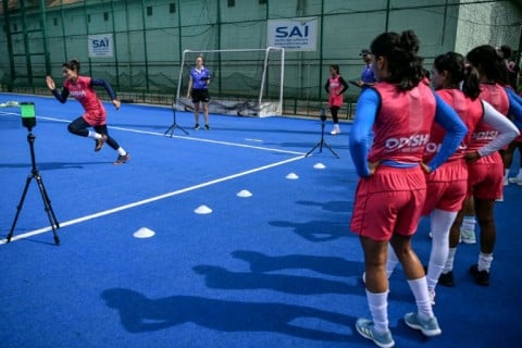 Members of the Indian women's squad train at the Sports Authority of India centre in the heat and humidity of Bengaluru