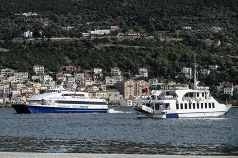 Ferries going back and forth to Turkey bring the influx of visitors, boosting the islands' economies