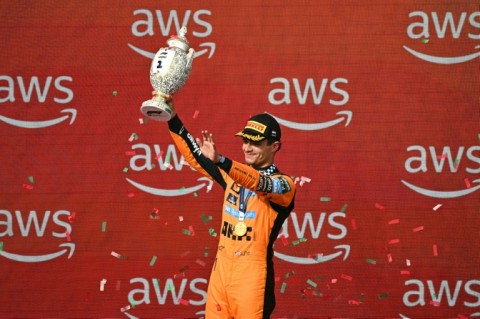 Lando Norris celebrates his first grand prix win of the season in Hungary