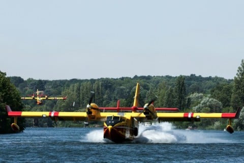 The planes scoop up thousands of liters of water in seconds by gliding along lake surfaces