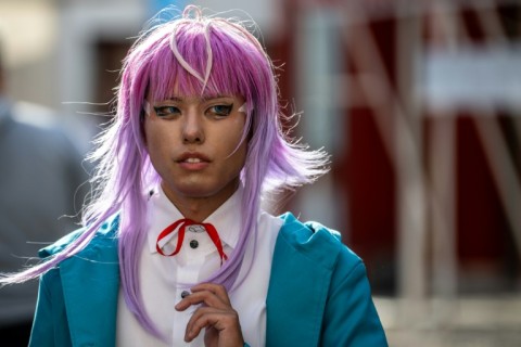 A cosplayer visits the Osu Shopping Street before the Osu Cosplay Parade, during the second day of the World Cosplay Summit 2026 in Nagoya on August 1, 2026.