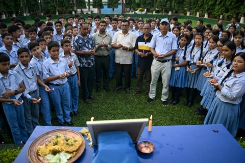 Mourners and students paid their respects to mountaineer Nirmal Purja, gathering around a framed photograph of the climber
