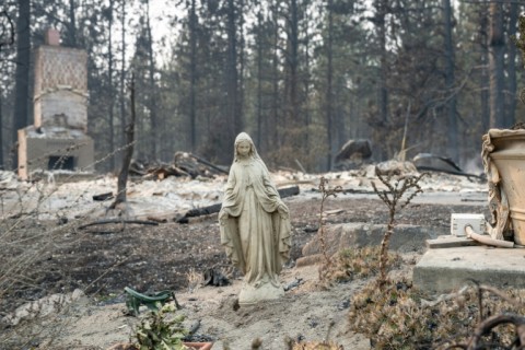 US northwest battles wildfires after Spokane neighborhoods scorched
