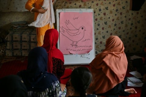 Girls studying at a secret school at an undisclosed location in Afghanistan in 2022