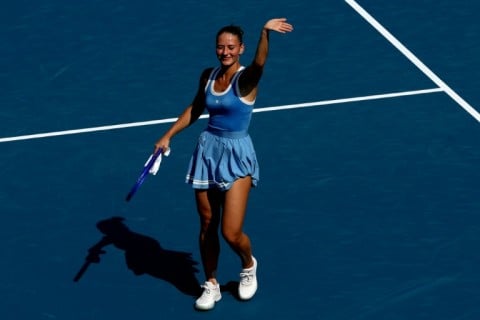 Ukraine's Marta Kostyuk salutes fans after making it through to the third round of the WTA 1000 in Toronto