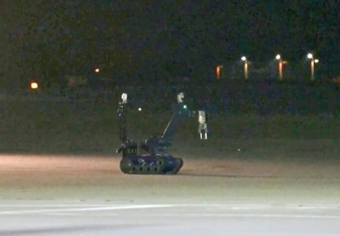 An image from video footage taken by News5 shows a bomb disposal robot at German airport Leipzig-Halle after a drone was spotted nearby