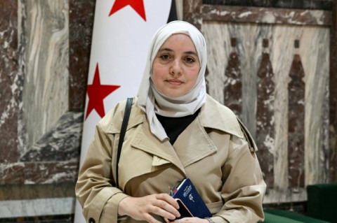Syria's member of parliament Nour Jandali poses inside one of the halls of the parliament in Damascus on July 27, 2026
