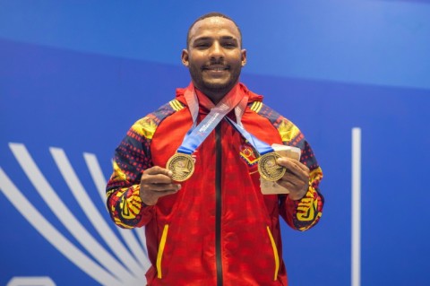 Venezuela's Julio Mayora, seen here in a handout picture from the Central American and Caribbean Games, carried cement blocks to rescue people following the twin earthquakes that struck Venezuela in June