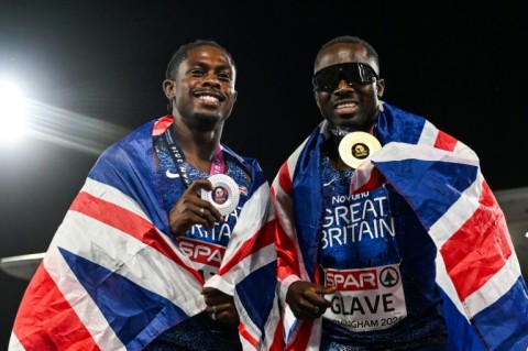 Silver medallist Jeremiah Azu (L) and gold medallist Romell Glave celebrate after the men's 100m