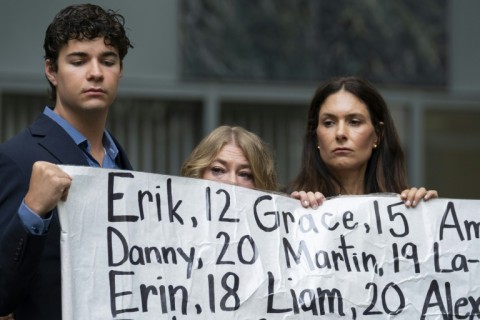 Outside court, activists held a banner with the names of nearly 400 young people whose deaths were allegedly connected to their social media use