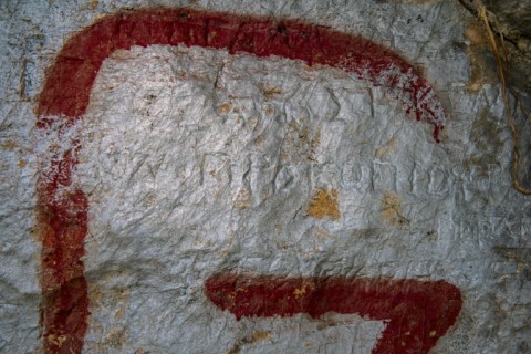 Greek writing can be seen carved into the wall of the cave -- but it is not clear how old it is